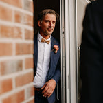 man wearing cork bow tie with silver bling for wedding