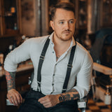 young man wearing black cork suspenders