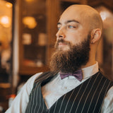 guy with beard and purple cork bow tie