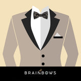 beige suit and black and gold bow tie