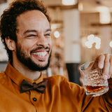 man wearing chocolate brown bow tie