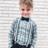 boy wearing green cork bow tie and braces