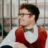 man wearing olive green cork bow tie