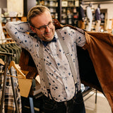 man wearing light blue suspenders with blue cork fabric