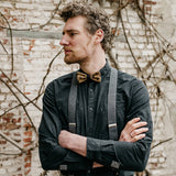 man wearing black shirt and suspenders made from recycled jeans