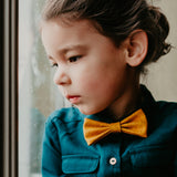 girl with yellow bow tie