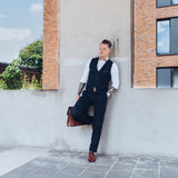 business man with tattoos and wooden bow tie