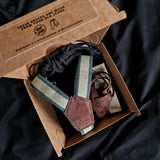 vegan braces made from recycled denim yarn in a creative packaging