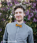 man wearing mustard cork bow tie