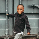 smiling boy with black bow tie