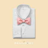 pink cork bow tie on a white dress shirt