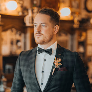 young man with black bow tie