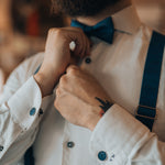 blue suspenders and bow tie