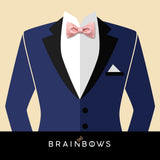 navy blue suit and pink cork bow tie