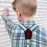 young boy wearing handmade suspenders with cork fabric