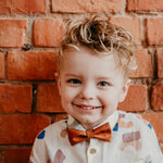 boy wearing cognac brown bow tie