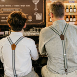 father and son wearing recycled jeans suspenders