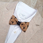 beige blazer with art deco cork bow tie