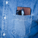 wooden card holder in jeans shirt