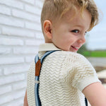 cute boy wearing handmade kids braces made from recycled jeans and cork fabric