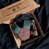 burger box containing braces made from old jeans and cork