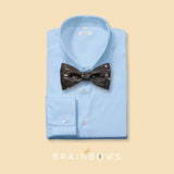 black and gold cork bow tie on a light blue dress shirt