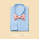 pink cork bow tie on a light blue dress shirt