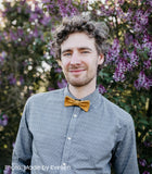 man wearing mustard cork bow tie