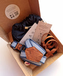 handmade suspenders made from recycled jeans packed in a burger box