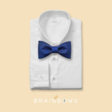 cobalt blue cork bow tie on a white dress shirt